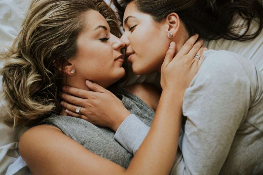Empowering Lesbian Sexual Health: A Guide to Safe Intimacy, Open Conversations, and Informed Well-Being 4 Lesbian couple kissing in the morning